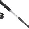 Straight grip aluminum hiking pole standing upright in ground