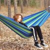 Portable hammock hanging between trees outdoors