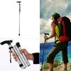 Folded walking stick placed in travel bag