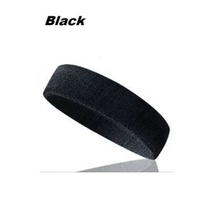 Athletic man adjusting sports sweatband before jogging