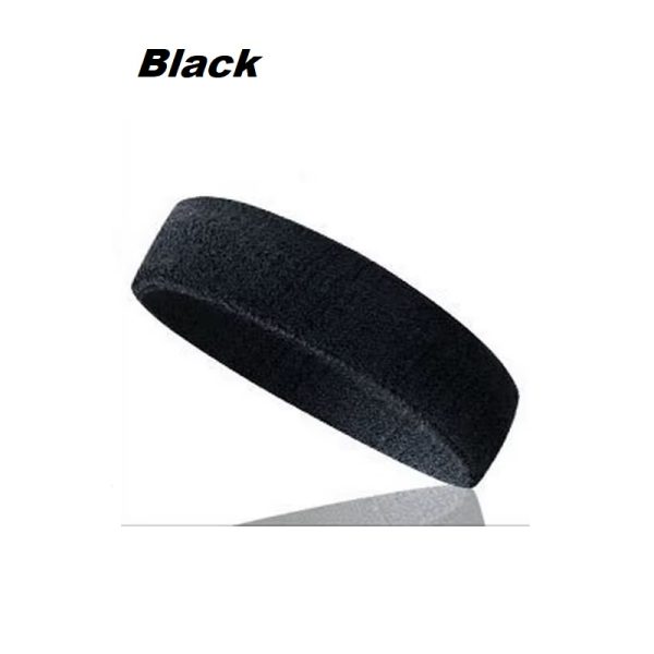 Athletic man adjusting sports sweatband before jogging